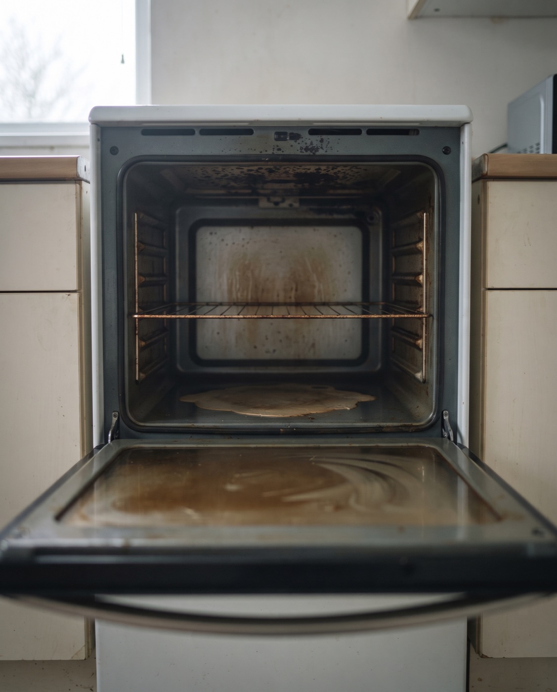 The inside of an oven at the end of a tenancy